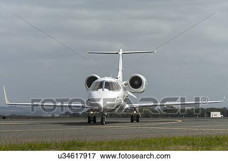 Stock Photo - Bombardier Learjet 60XR landing at Avalon Airport during Australian Bicentennial Air Show. Fotosearch