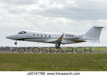 Bombardier Learjet 60XR landing at Avalon Airport View Large Photo Image Stock Photo - Bombardier Learjet 60XR landing at Avalon Airport . Fotosearch