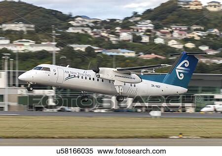 Bombardier Q300 taking off from Wellington Airport View Large Photo Image Stock Photography - Bombardier Q300 taking off from Wellington Airport. Fotosearch