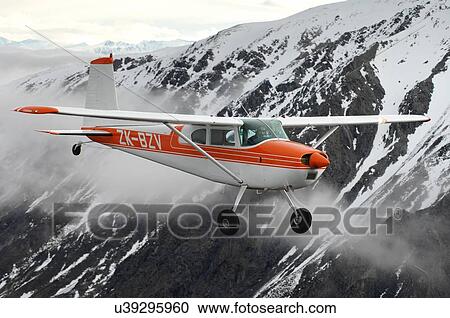 Stock Image - Cessna 180 near Lake Tekapo, New Zealand. Fotosearch