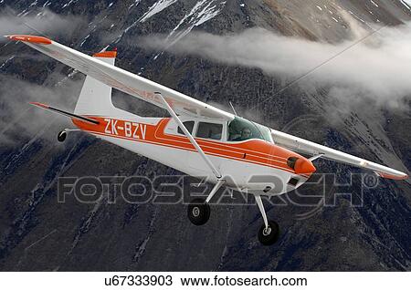 Stock Image - Cessna 180 near Lake Tekapo, New Zealand. Fotosearch