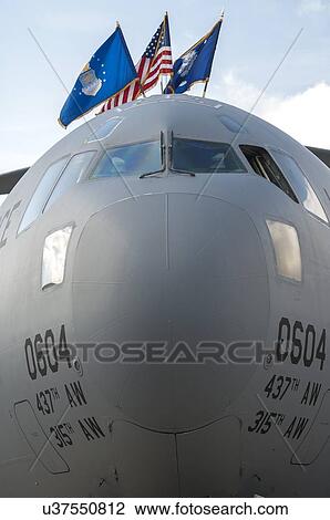 Stock Image - Close-up of Boeing C-17 Globemaster III nose and flags. Fotosearch