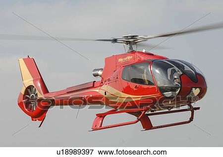 EC130B4 helicopter flying View Large Photo Image Stock Photo - EC130B4 helicopter flying . Fotosearch