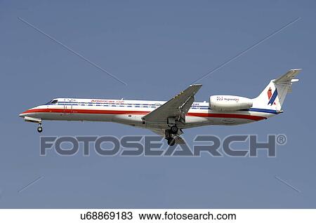 Stock Image - Embraer 135KL of American Eagle on final approach to Los Angeles International Airport. Fotosearch