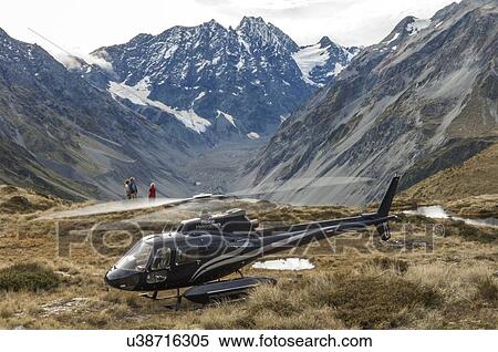 Eurocopter (Aerospatiale) AS350BA on a mountain at the head of the Rakaia River, South Island, New Zealand View Large Photo Image Stock Photography - Eurocopter (Aerospatiale) AS350BA on a mountain at the head of the Rakaia River, South Island, New Zealand. Fotosearch