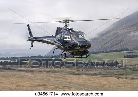 Eurocopter (Aerospatiale) AS350BA Methven over the Rakaia River, South Island, New Zealand View Large Photo Image Picture - Eurocopter (Aerospatiale) AS350BA Methven over the Rakaia River, South Island, New Zealand. Fotosearch