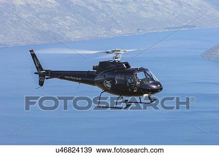 Stock Photo - Eurocopter AS350BA in flight . Fotosearch