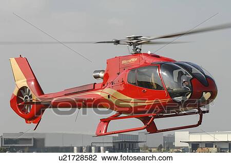 Eurocopter EC130B4 helicopter landing at Moorabbin Airport, Melbourne, Australia View Large Photo Image Stock Image - Eurocopter EC130B4 helicopter landing at Moorabbin Airport, Melbourne, Australia. Fotosearch