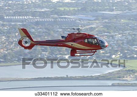 Eurocopter EC130B4 in flight over Melbourne View Large Photo Image Stock Image - Eurocopter EC130B4 in flight over Melbourne. Fotosearch