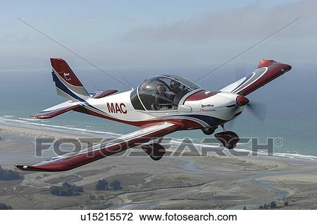 Stock Image - Evektor-Aerotechnik SportStar light aircraft in flight over North Canterbury. Fotosearch