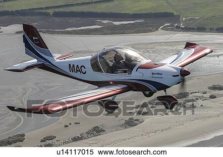 Stock Photography - Evektor-Aerotechnik SportStar light aircraft in flight over North Canterbury. Fotosearch
