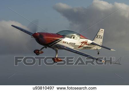 Stock Photo - Extra Aircraft Extra 300 in flight . Fotosearch