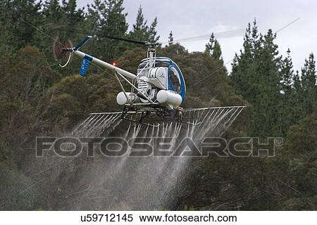 Flight conducting aerial spraying View Large Photo Image Stock Photography - Flight conducting aerial spraying. Fotosearch