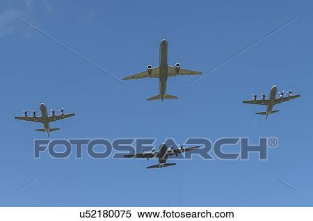 Stock Photography - Formation flight by Royal New Zealand Air Force aircraft; Boeing 757 leads two Lockheed P-3K Orions and a single Lockheed C-130H Hercules. Fotosearch