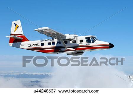 Stock Photo - GAF Nomad in flight near Lake Tekapo. Fotosearch