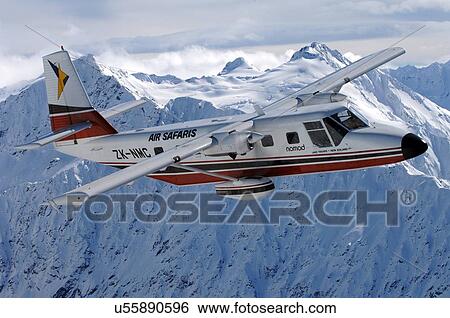 GAF Nomad in flight over mountains near Lake Tekapo View Large Photo Image Stock Photograph - GAF Nomad in flight over mountains near Lake Tekapo. Fotosearch