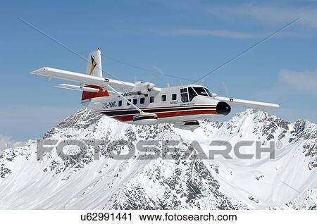 Stock Image - GAF Nomad over mountains near Lake Tekapo, New Zealand. Fotosearch