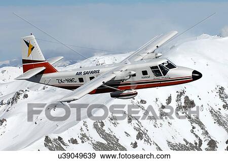 GAF Nomad over mountains near Lake Tekapo View Large Photo Image Stock Photo - GAF Nomad over mountains near Lake Tekapo. Fotosearch