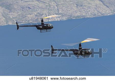 Helicopter formation of two Robinson R44s over Lake Wakatipu near Queenstown, New Zealand. View Large Photo Image Stock Image - Helicopter formation of two Robinson R44s over Lake Wakatipu near Queenstown, New Zealand.. Fotosearch