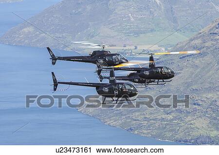 Helicopter formation over Lake Wakatip; two Robinson R44s and two Eurocopter AS350s View Large Photo Image Stock Image - Helicopter formation over Lake Wakatip; two Robinson R44s and two Eurocopter AS350s. Fotosearch
