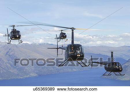 Stock Photo - Helicopter formation over Lake Wakatipu. Fotosearch