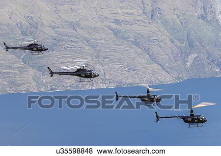 Helicopters formation over Lake Wakatipu View Large Photo Image Stock Photo - Helicopters formation over Lake Wakatipu. Fotosearch