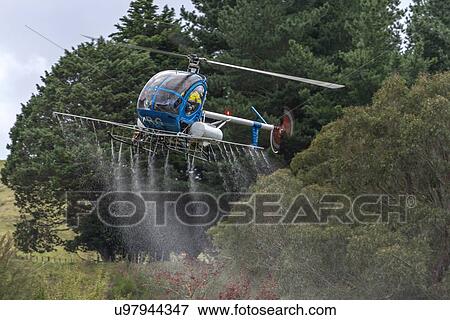 Hughes 269C in flight conducting aerial spraying View Large Photo Image Stock Photo - Hughes 269C in flight conducting aerial spraying. Fotosearch