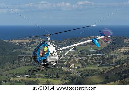 Picture - Hughes 269C in flight. Fotosearch