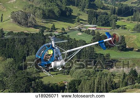 Hughes 269C in flight View Large Photo Image Stock Image - Hughes 269C in flight. Fotosearch