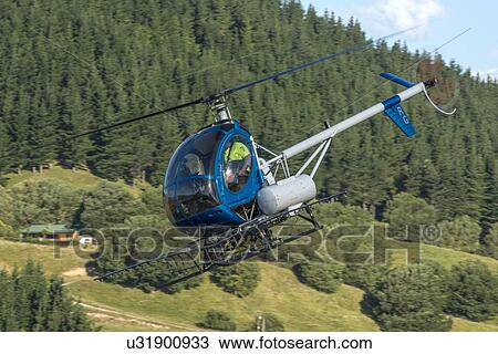 Hughes 269C in flight View Large Photo Image Stock Image - Hughes 269C in flight. Fotosearch