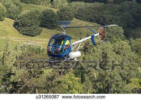 Hughes 269C in flight View Large Photo Image Stock Photo - Hughes 269C in flight. Fotosearch