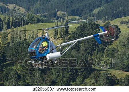 Hughes 269C in flight View Large Photo Image Stock Photo - Hughes 269C in flight. Fotosearch
