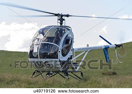 Stock Photograph - Hughes 269C parked . Fotosearch