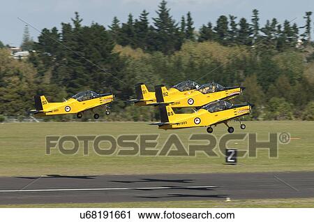 Stock Image - Pacific Aerospace CT-4E Airtrainers take off from Whenuapai Air Base. Fotosearch