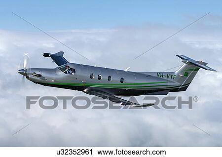 Stock Image - Pilatus PC12 in flight near Wellington. Fotosearch