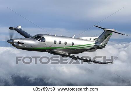 Stock Photo - Pilatus PC12NG in flight near Wellington. Fotosearch
