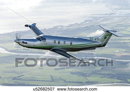 Stock Photo - Pilatus PC12NG in flight near Wellington. Fotosearch