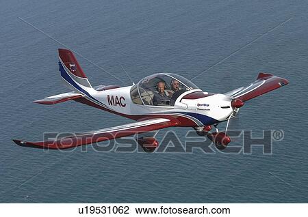 SportStar light aircraft in flight over water View Large Photo Image Stock Image - SportStar light aircraft in flight over water. Fotosearch