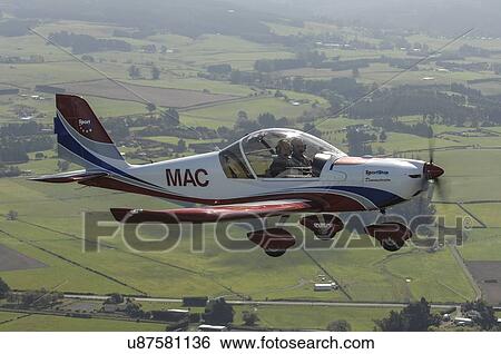 Stock Photograph - SportStar light aircraft in flight over North Canterbury. Fotosearch