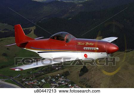 Thunder Mustang in flight near Auckland View Large Photo Image Stock Image - Thunder Mustang in flight near Auckland. Fotosearch