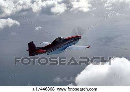 Stock Photo - Thunder Mustang in flight near Auckland. Fotosearch