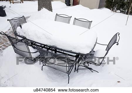Picture - Patio set in snow. Fotosearch