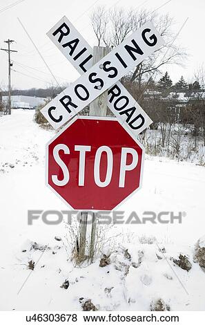 Railroad crossing and stop sign View Large Photo Image Stock Photo - Railroad crossing and stop sign. Fotosearch