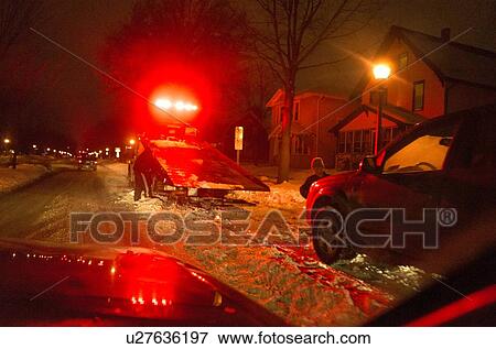Stock Photo - Tow truck with flashing red lights. Fotosearch