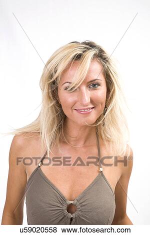 Stock Photo - Blonde woman looking at camera. Fotosearch