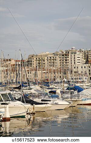 Stock Image - Boats at anchor in harbor. Fotosearch