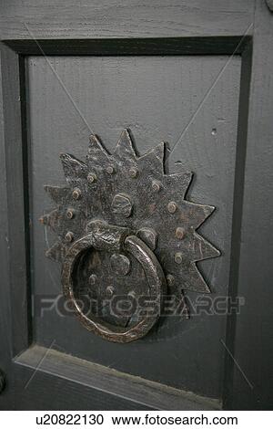 Stock Image - Brass door knocker. Fotosearch