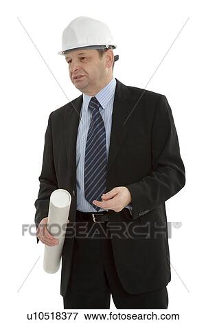 Stock Photo - Business man with plans wearing a hard hat. Fotosearch