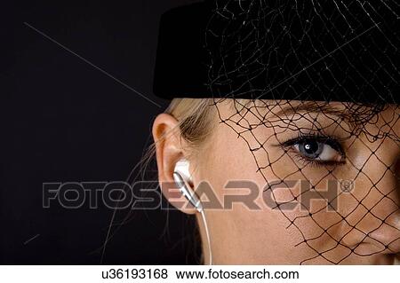Close-up of woman with headphone View Large Photo Image Stock Photo - Close-up of woman with headphone. Fotosearch
