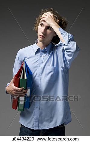 Stock Photo - Concerned young man. Fotosearch